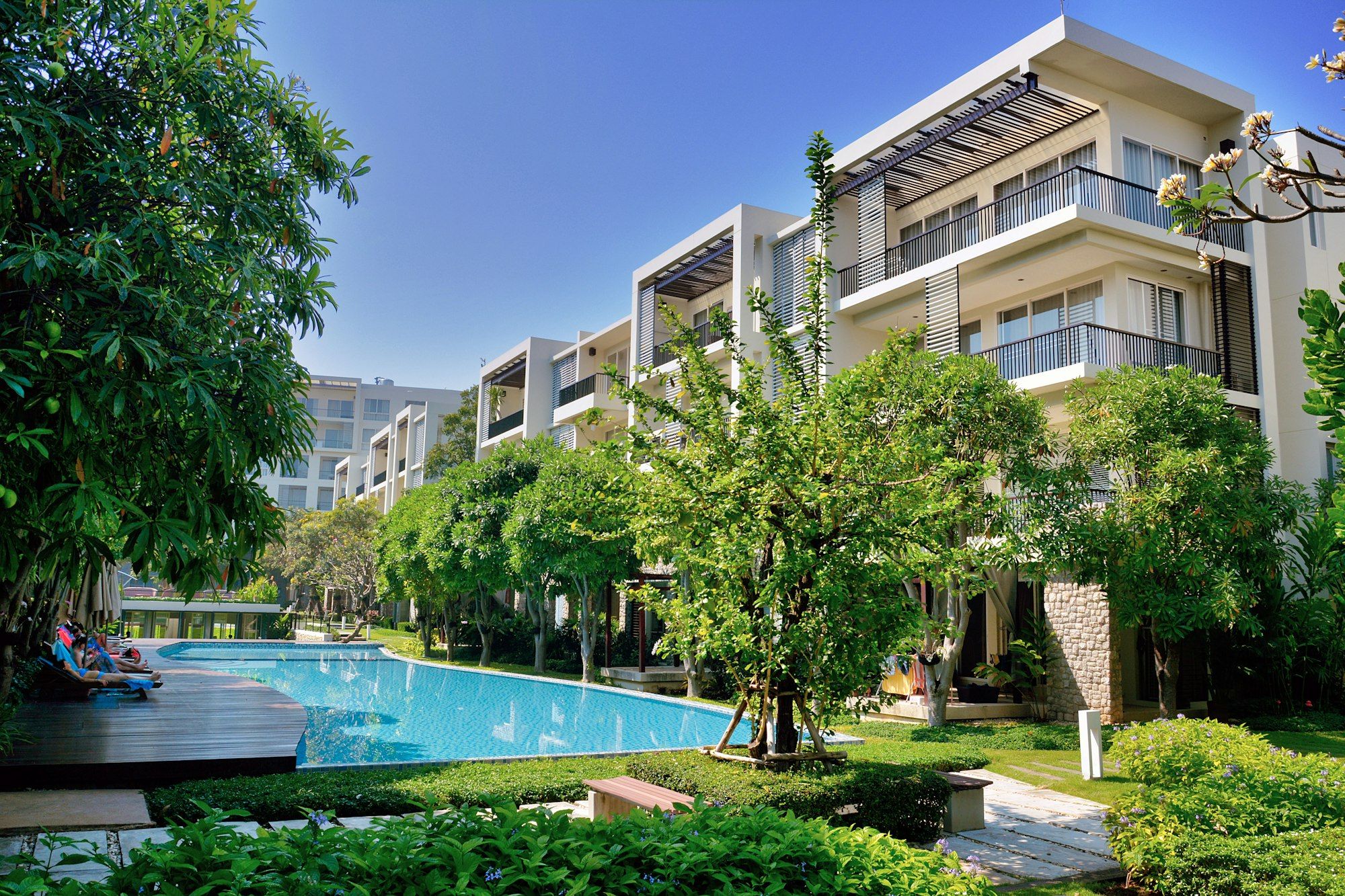Apartment buildings around a garden pool