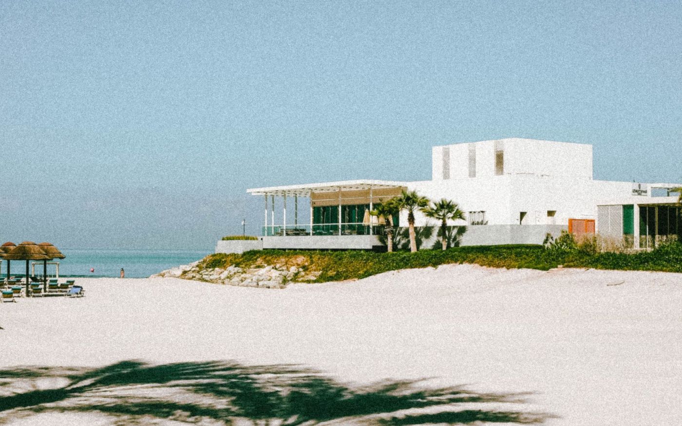 A white beachfront building on the Ras Al Khaimah coast